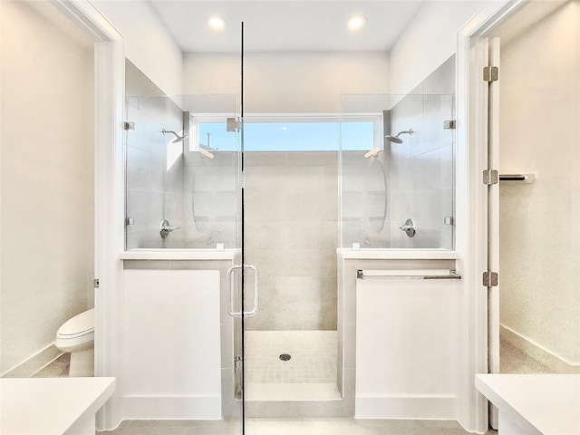7705 Westside Villas Ln, Houston, TX 77055 - bathroom with a stall shower, vanity, toilet, and plenty of natural light