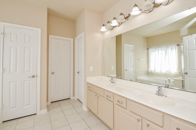 24242 Yelverton Glen Dr, Katy, TX 77493 - full bathroom featuring a sink, tile patterned flooring, a garden tub, and double vanity