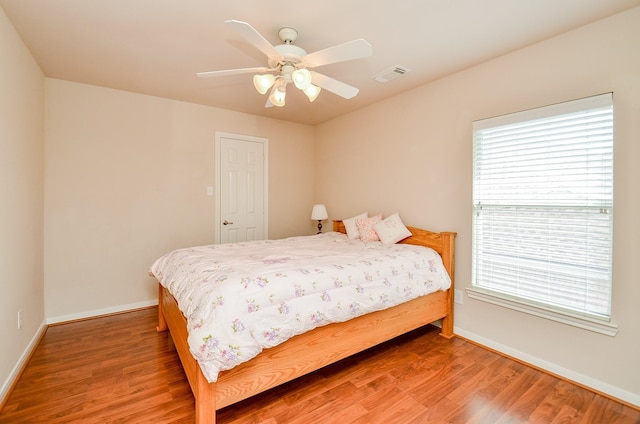 24242 Yelverton Glen Dr, Katy, TX 77493 - bedroom featuring baseboards, visible vents, multiple windows, and light wood-style floors