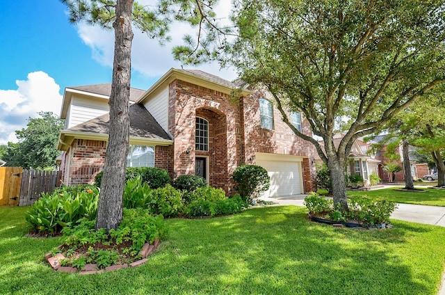 24242 Yelverton Glen Dr, Katy, TX 77493 - traditional-style house featuring brick siding, fence, a front yard, and a garage