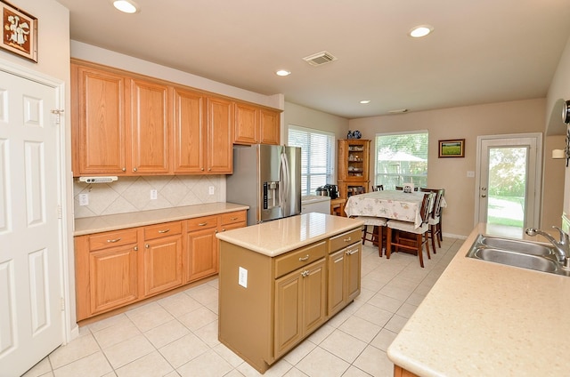 24242 Yelverton Glen Dr, Katy, TX 77493 - kitchen featuring visible vents, a sink, light countertops, and stainless steel fridge with ice dispenser
