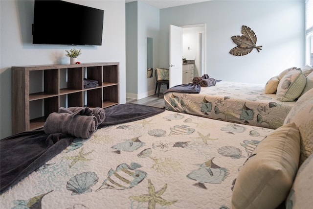 4413 Strand Ave, Port Bolivar, TX 77650 - bedroom featuring wood finished floors and baseboards