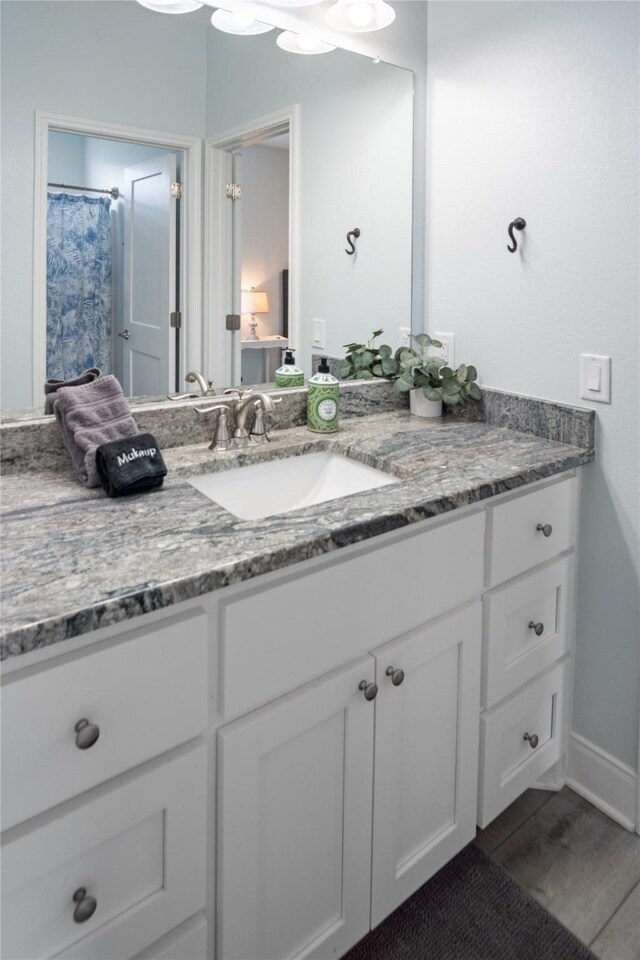 4413 Strand Ave, Port Bolivar, TX 77650 - full bath with vanity and wood finished floors