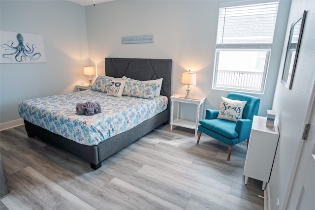 4413 Strand Ave, Port Bolivar, TX 77650 - bedroom featuring wood finished floors and baseboards