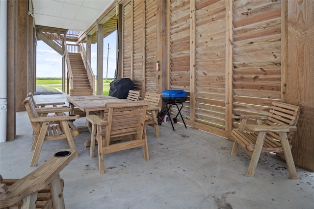 4413 Strand Ave, Port Bolivar, TX 77650 - view of patio with stairs, outdoor dining space, and area for grilling