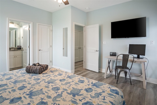4413 Strand Ave, Port Bolivar, TX 77650 - bedroom featuring wood finished floors, baseboards, an office area, ensuite bath, and ceiling fan