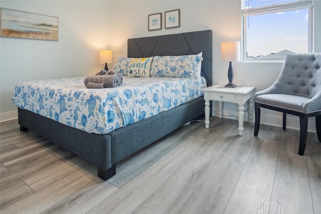 4413 Strand Ave, Port Bolivar, TX 77650 - bedroom with wood finished floors and baseboards