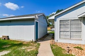 view of property exterior with mail area