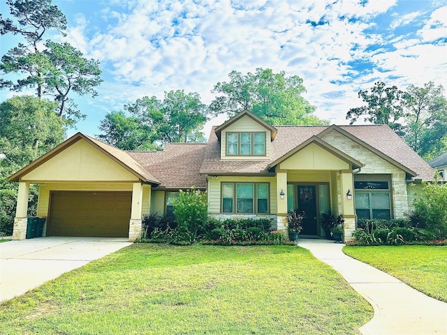 112 Timberside Dr, Conroe, TX 77304 - craftsman house with stone siding, an attached garage, a front lawn, concrete driveway, and roof with shingles