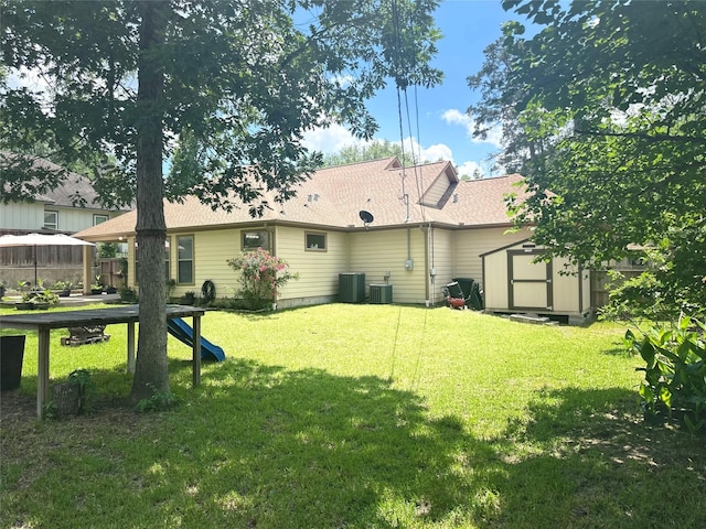 112 Timberside Dr, Conroe, TX 77304 - rear view of property featuring a storage unit, a gazebo, a lawn, and an outbuilding
