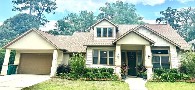 112 Timberside Dr, Conroe, TX 77304 - craftsman house with stone siding, a shingled roof, a garage, driveway, and a front yard