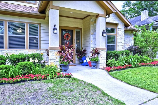 112 Timberside Dr, Conroe, TX 77304 - view of exterior entry featuring stone siding