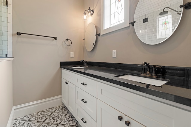 1708 Shearn St, Houston, TX 77007 - full bath with baseboards, tiled shower, and double vanity