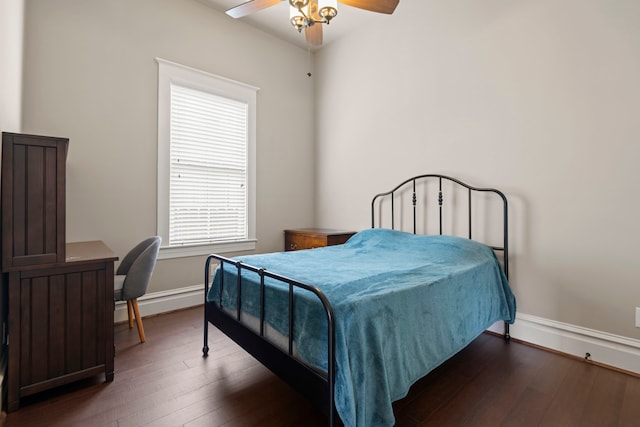 1708 Shearn St, Houston, TX 77007 - bedroom with dark wood-style flooring, baseboards, and ceiling fan