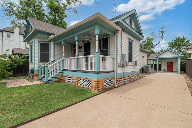 1708 Shearn St, Houston, TX 77007 - bungalow with a porch, a carport, concrete driveway, central AC, and a ceiling fan