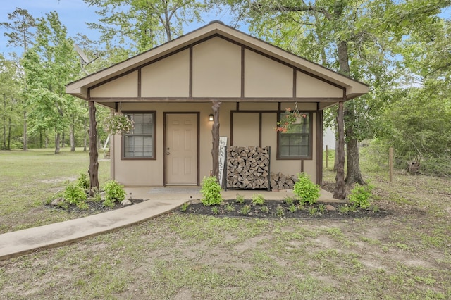 9948 Roda Dr, Conroe, TX 77303 - view of front facade with covered porch and stucco siding