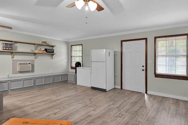 9948 Roda Dr, Conroe, TX 77303 - kitchen featuring an AC wall unit, freestanding refrigerator, a ceiling fan, gray cabinetry, and ornamental molding
