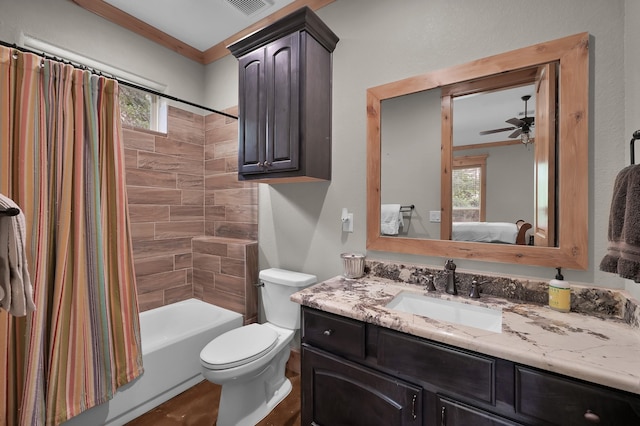 9948 Roda Dr, Conroe, TX 77303 - ensuite bathroom featuring a ceiling fan, vanity, toilet, shower / tub combo with curtain, and ensuite bathroom