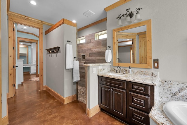 9948 Roda Dr, Conroe, TX 77303 - full bathroom featuring vanity, ornamental molding, concrete flooring, baseboards, and recessed lighting