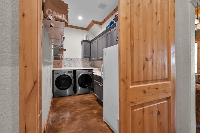 9948 Roda Dr, Conroe, TX 77303 - laundry area with independent washer and dryer, recessed lighting, visible vents, and cabinet space
