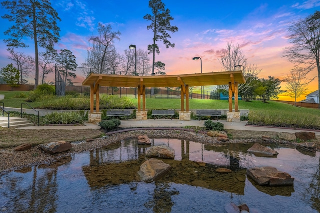 6188 White Spruce Dr, Conroe, TX 77304 - view of home's community with a lawn and a garden pond