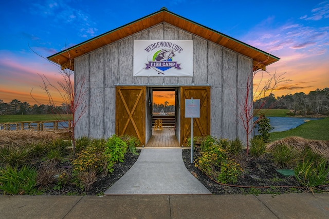 6188 White Spruce Dr, Conroe, TX 77304 - outdoor structure at dusk with an outdoor structure