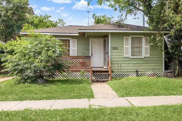 1206 Shearn St, Houston, TX 77007 - bungalow-style house with a shingled roof and a front lawn