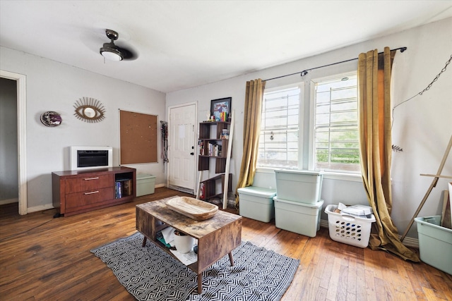 1206 Shearn St, Houston, TX 77007 - living room featuring wood-type flooring, heating unit, and baseboards