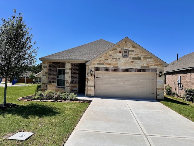 6107 White Spruce Dr, Conroe, TX 77304 - view of front of home with a garage, concrete driveway, a front lawn, roof with shingles, and stone siding
