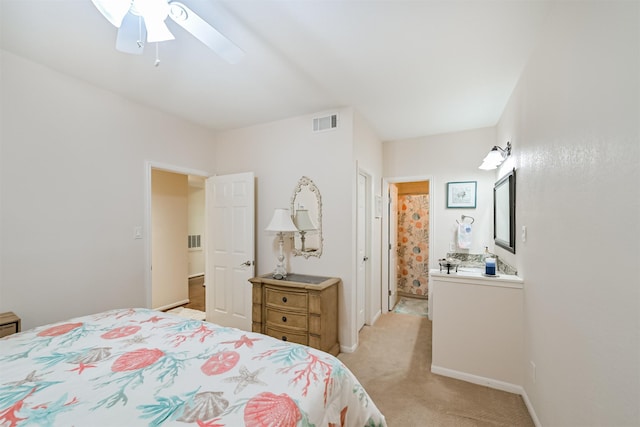bedroom with light colored carpet, a ceiling fan, and visible vents