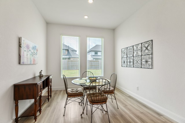 dining room featuring recessed lighting, baseboards, and light wood-type flooring