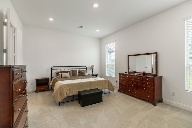 bedroom with recessed lighting, baseboards, visible vents, and light carpet