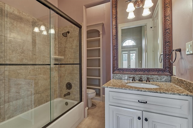 28822 Saddle Oak Dr, Montgomery, TX 77356 - bathroom with vanity, enclosed tub / shower combo, and toilet