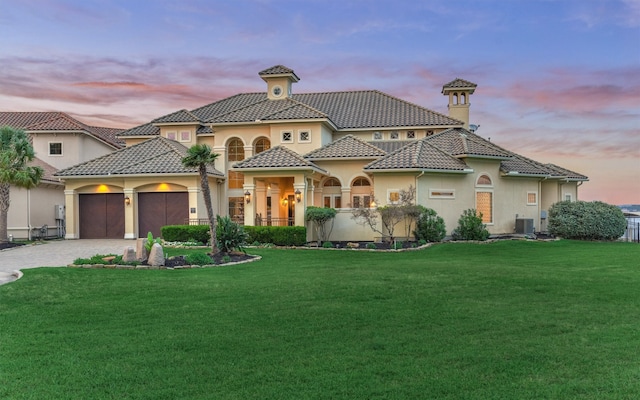 28822 Saddle Oak Dr, Montgomery, TX 77356 - view of front of house featuring a yard, central AC, and stucco siding