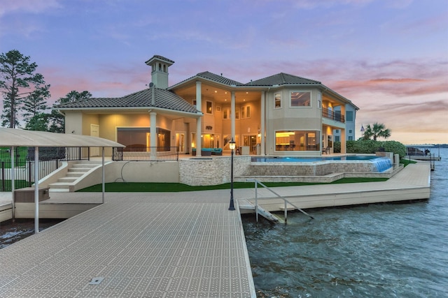 28822 Saddle Oak Dr, Montgomery, TX 77356 - back of house with a water view, a tile roof, a balcony, and stucco siding