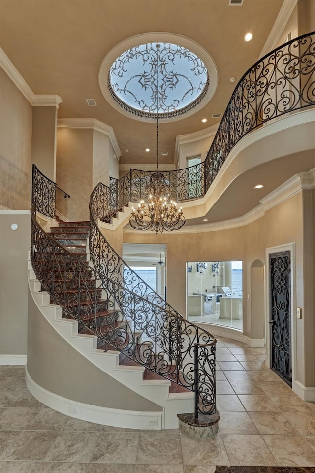 28822 Saddle Oak Dr, Montgomery, TX 77356 - staircase featuring baseboards, a high ceiling, recessed lighting, and arched walkways