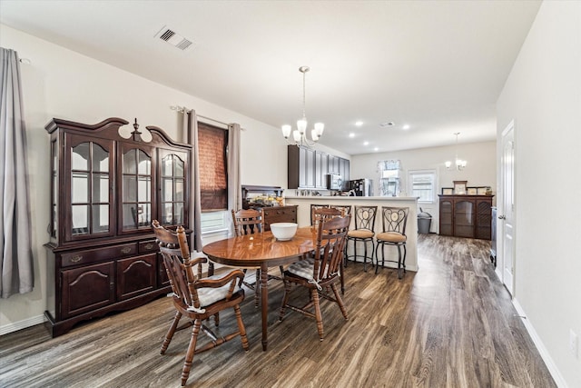 13127 Clifton Hill Ln, Houston, TX 77044 - dining room featuring an inviting chandelier, baseboards, visible vents, and dark wood-style floors