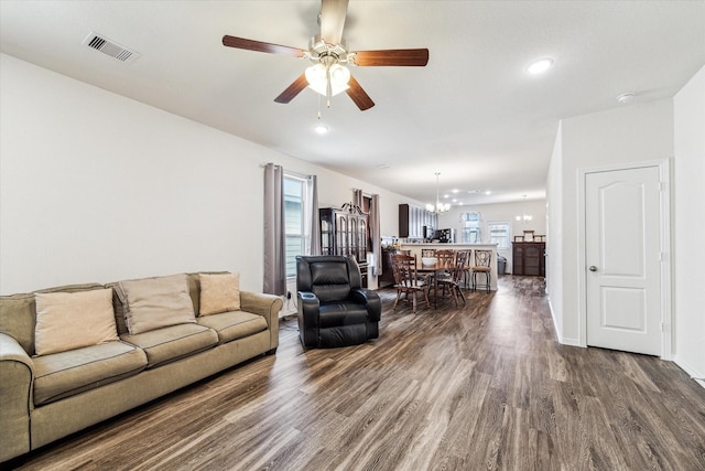 13127 Clifton Hill Ln, Houston, TX 77044 - living room with visible vents, recessed lighting, dark wood finished floors, and ceiling fan with notable chandelier