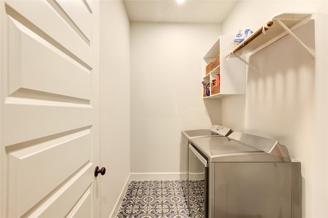 laundry room featuring baseboards, laundry area, and independent washer and dryer