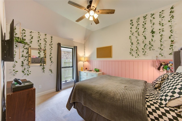 bedroom with light colored carpet, lofted ceiling, and ceiling fan