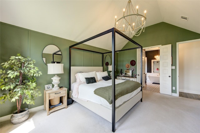 bedroom featuring ensuite bathroom, carpet, vaulted ceiling, an inviting chandelier, and baseboards