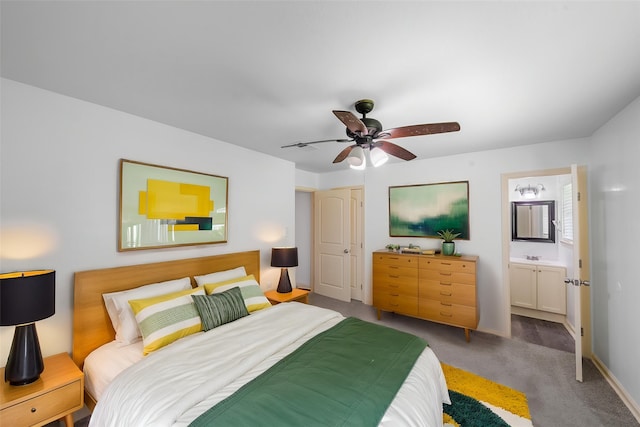 bedroom featuring ensuite bathroom, carpet flooring, baseboards, and ceiling fan