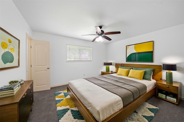 bedroom with ceiling fan and dark colored carpet