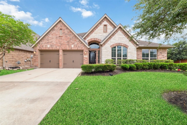 11143 Dunstan Hill Dr, Richmond, TX 77407 - view of front of property featuring brick siding, a front yard, stone siding, driveway, and an attached garage