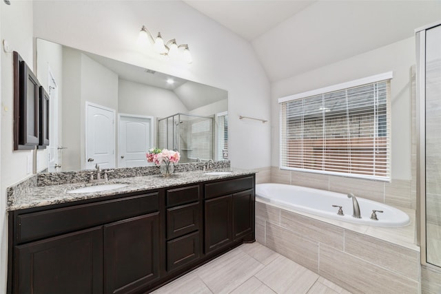 11143 Dunstan Hill Dr, Richmond, TX 77407 - full bath featuring vaulted ceiling, a stall shower, a bath, double vanity, and tile patterned flooring