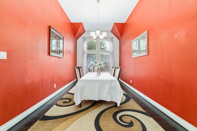11143 Dunstan Hill Dr, Richmond, TX 77407 - dining space featuring dark wood finished floors, a chandelier, baseboards, lofted ceiling, and a textured wall