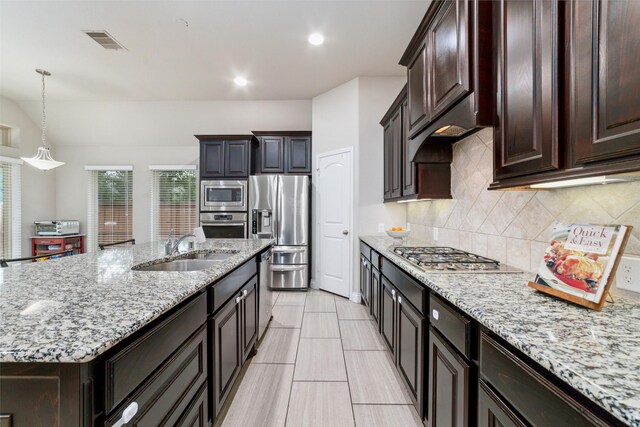 11143 Dunstan Hill Dr, Richmond, TX 77407 - kitchen with appliances with stainless steel finishes, a sink, plenty of natural light, tasteful backsplash, and recessed lighting