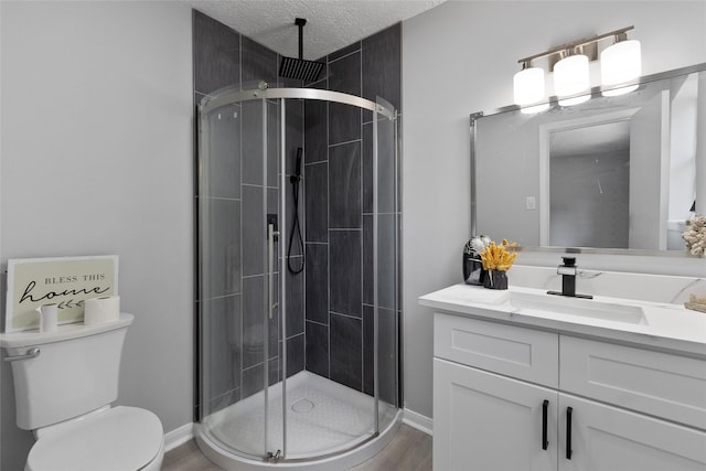full bath with vanity, toilet, baseboards, a shower stall, and wood finished floors