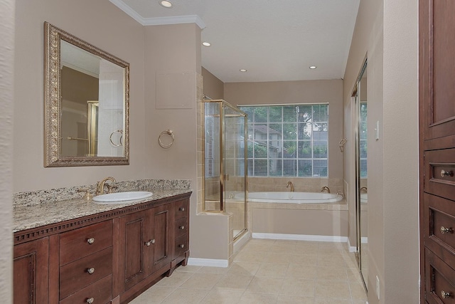 bathroom with vanity, tile patterned flooring, a garden tub, and a stall shower