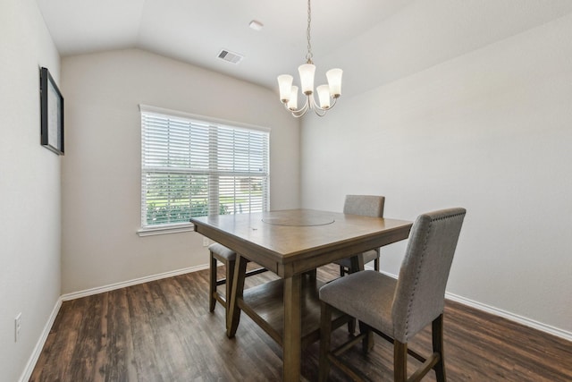 6011 Diantha St, Katy, TX 77449 - dining space with a chandelier, dark wood-type flooring, vaulted ceiling, and baseboards